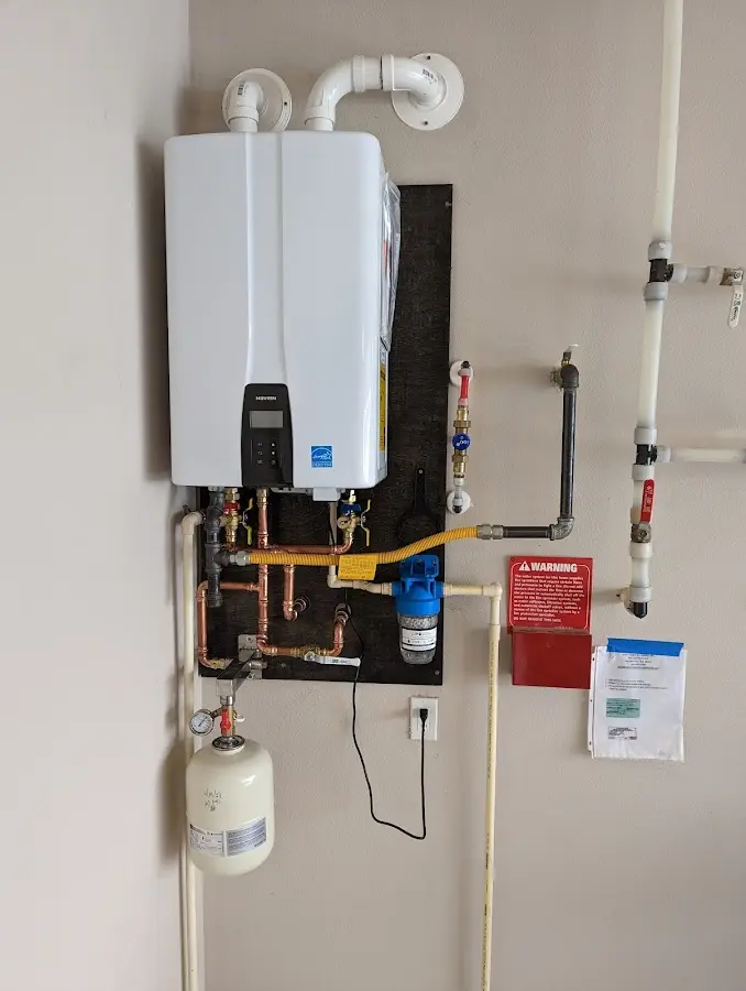 Professional plumber installing copper piping in a Yountville home